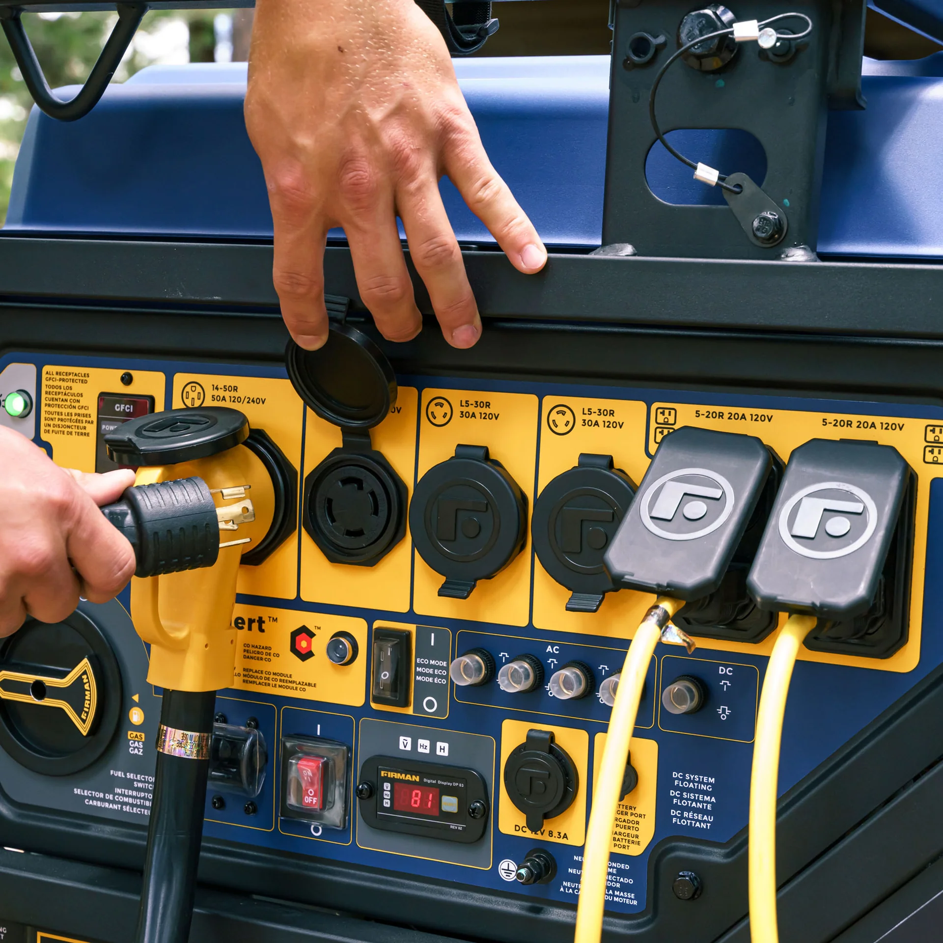 Man plugging generator power cord into Firman portable generator