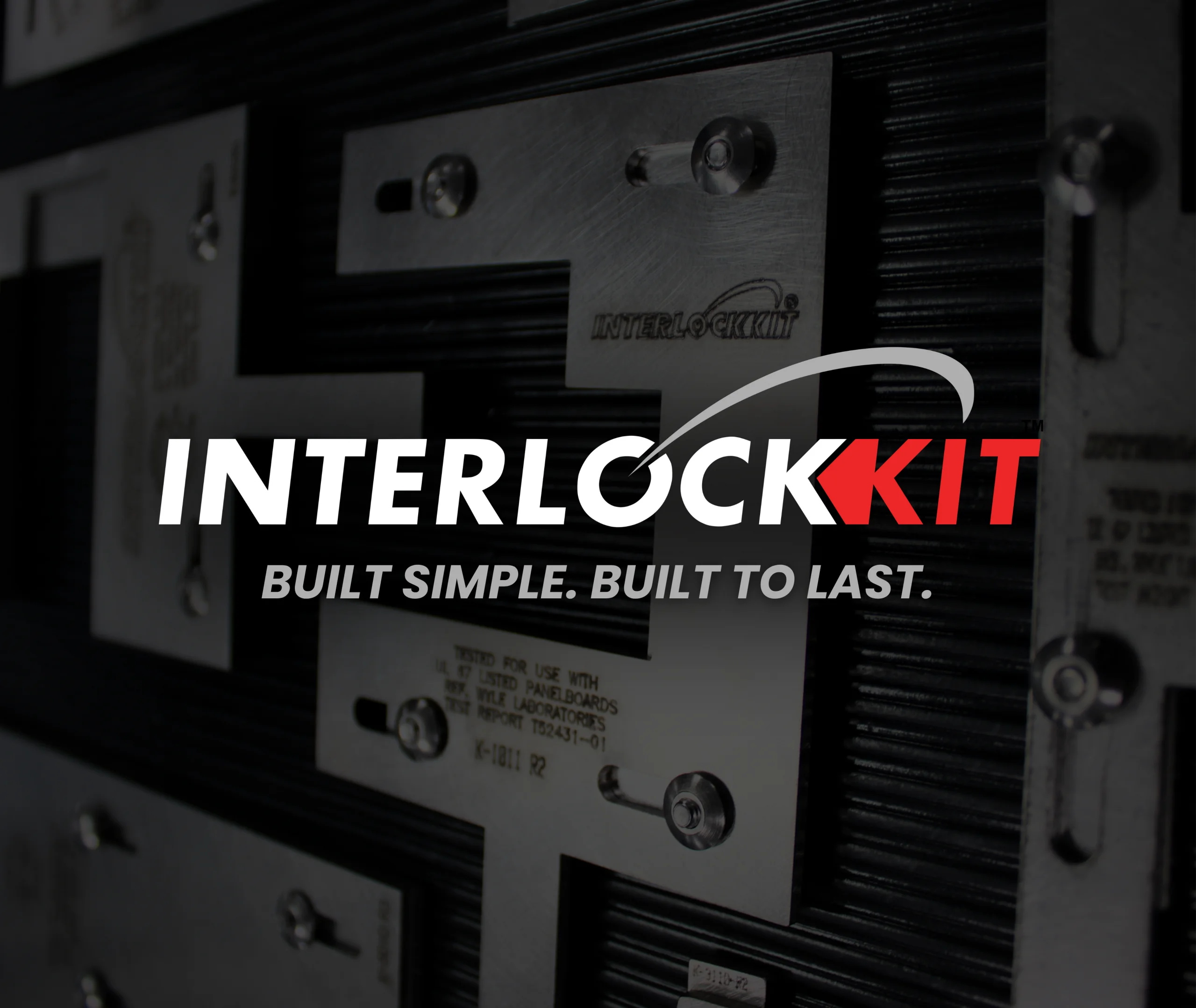 Interlockkit logo with the tagline "Built Simple. Built to Last." over a close-up photo of stainless steel generator interlock kits